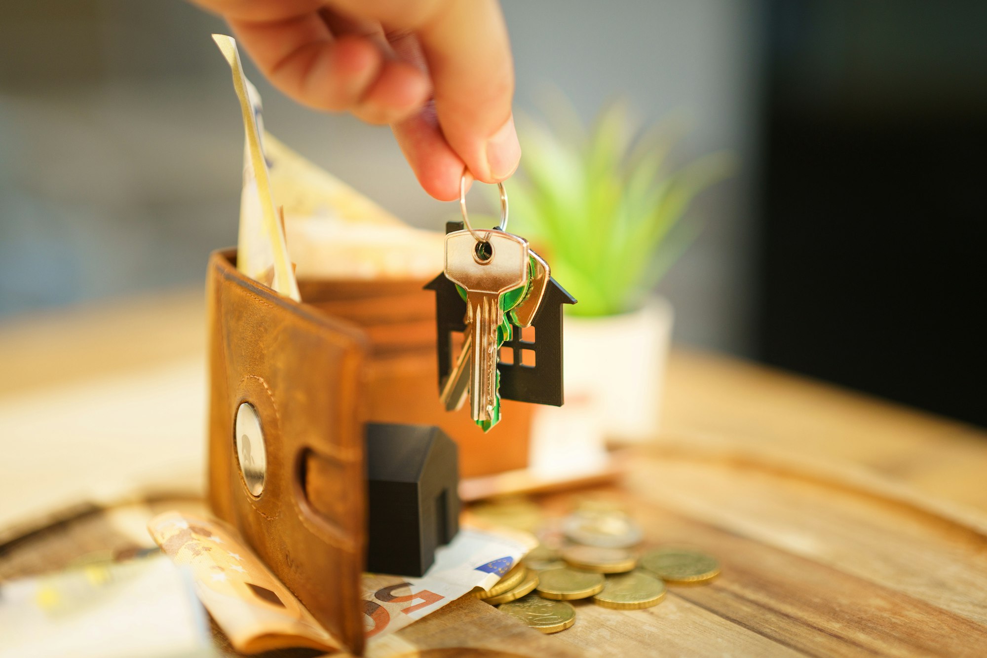 A hand holding house keys